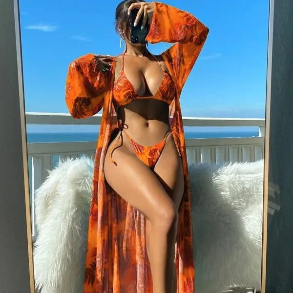 Blue two-piece bikini set with long sleeve blouse, banded briefs, and a robe.