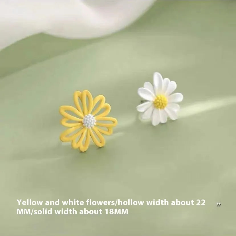 Close-up of cartoon-style flower stud earrings in alloy, shown in blue and orange two-tone colour combination.
