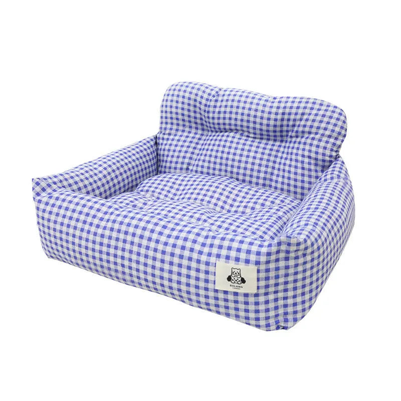 Car-mounted pet travel nest in stain-resistant cloth fabric showing grey and blue plaid options