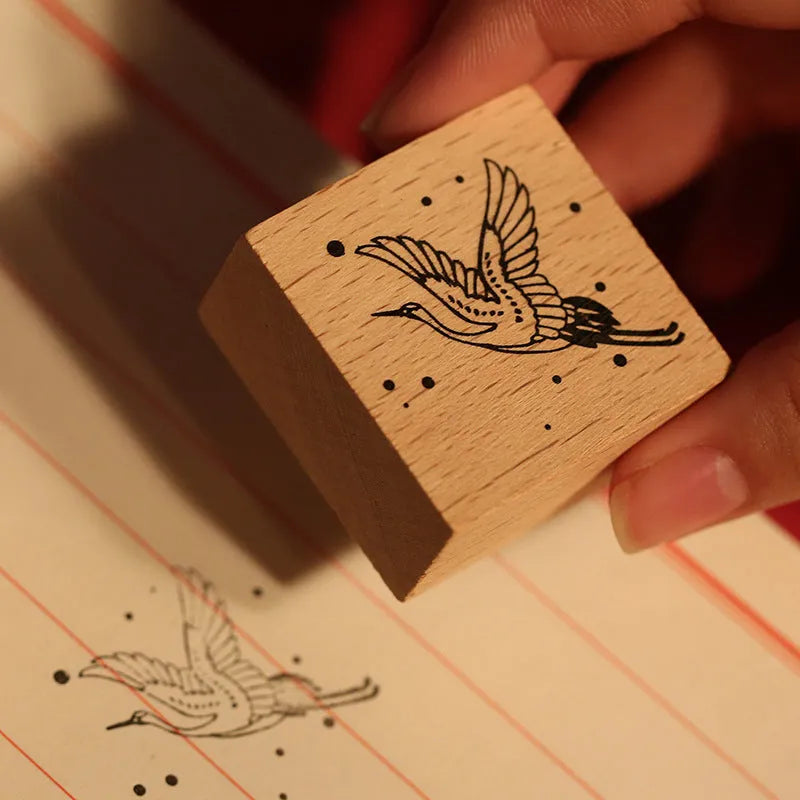 Mr Paper wooden seal set showing handcrafted stamp with crane design for DIY printing projects