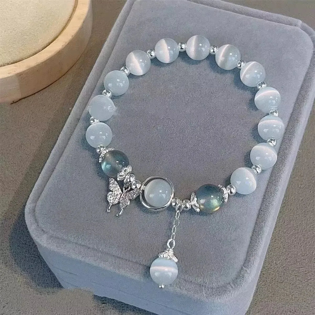 Handmade glass butterfly bracelet with coloured glaze and drop-shaped elements in grey moonlight beads