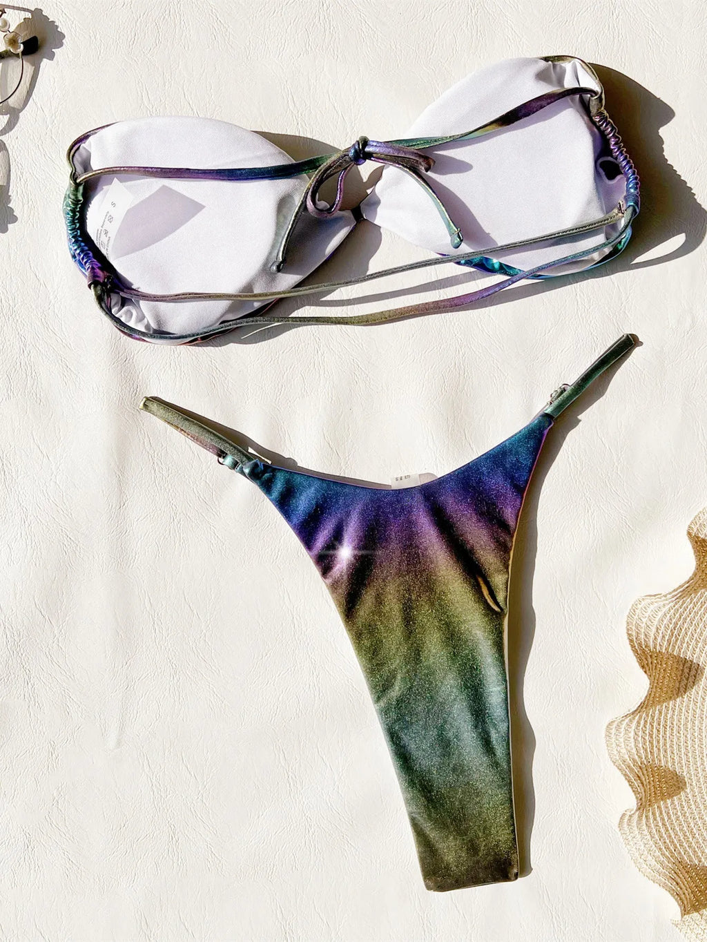 Women's gradient purple bikini swimsuit set on a white background.