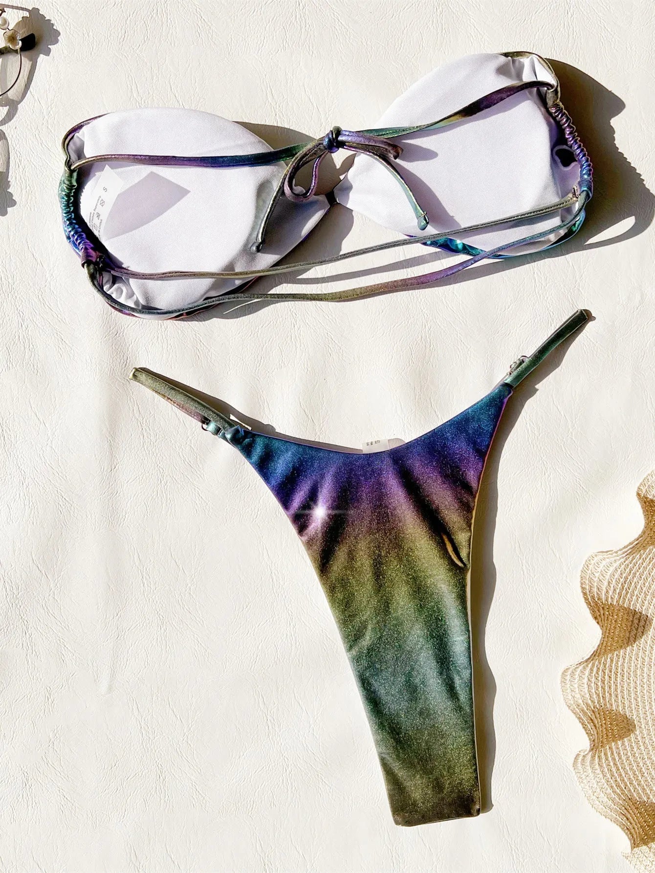 Women's gradient purple bikini swimsuit set on a white background.