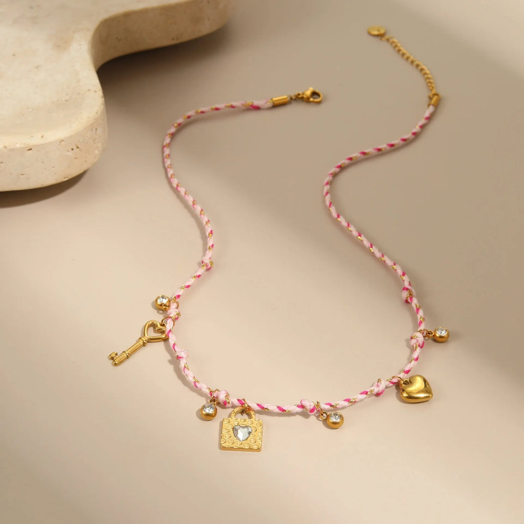Handmade braided rope titanium steel necklace with a choice of purple moon, pink lock, or blue XINGX electroplated pendant.