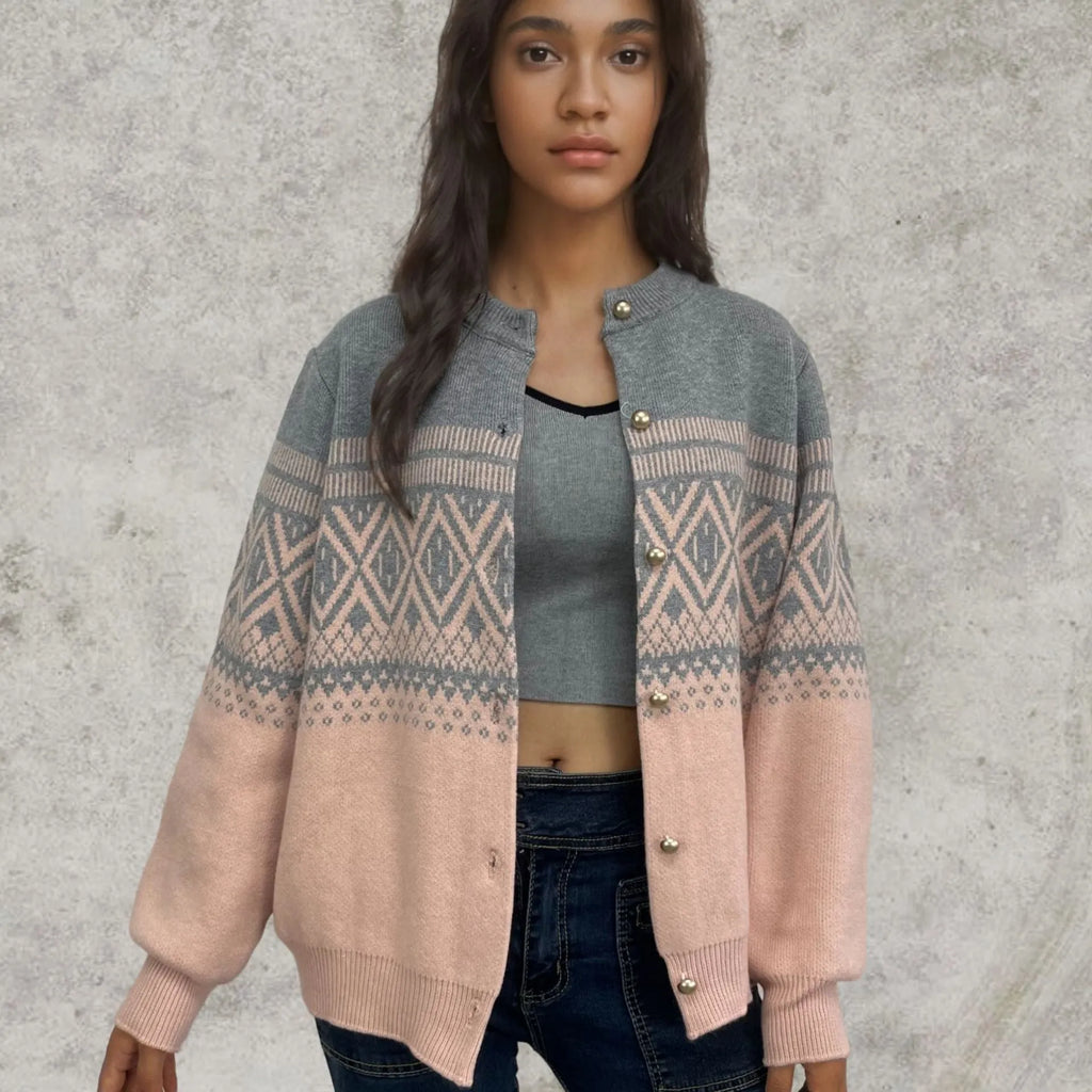 Women's grey alpaca wool cardigan with long sleeves and a diamond knit pattern in contrasting colours.