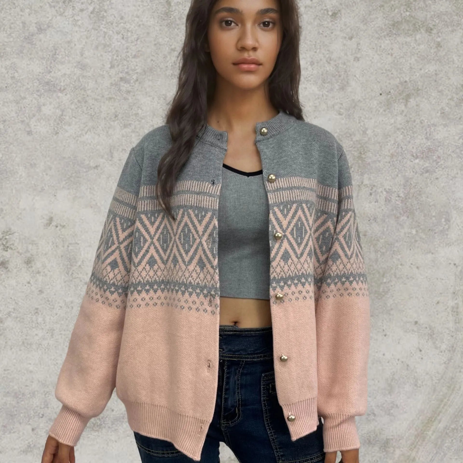 Women's grey alpaca wool cardigan with long sleeves and a diamond knit pattern in contrasting colours.