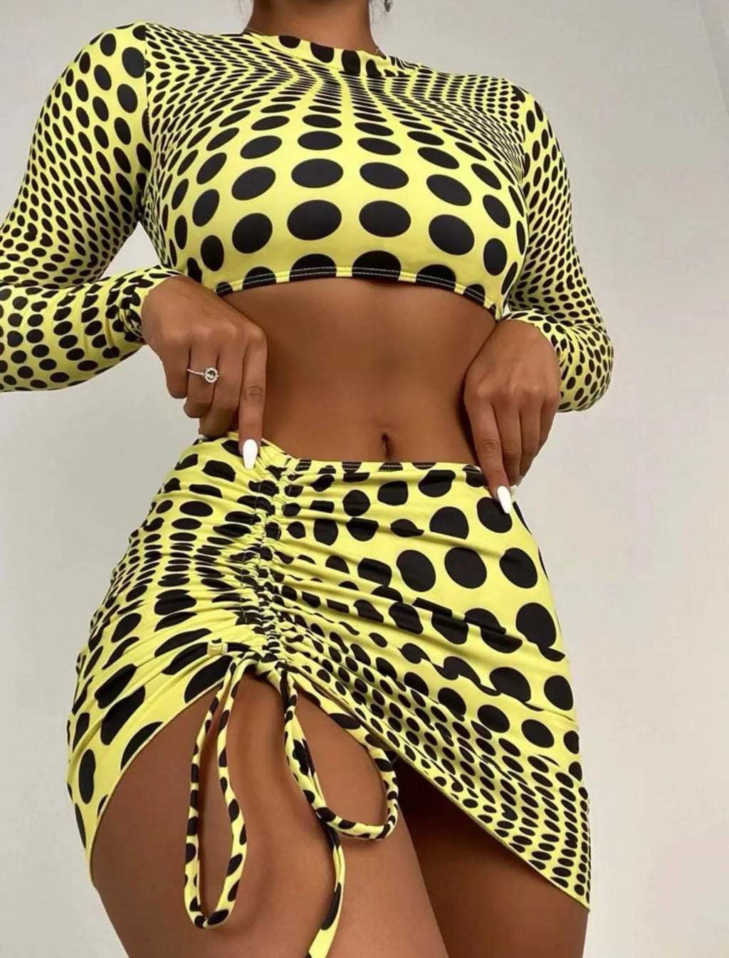 Women's polka dot swimsuit three-piece set in green colour with bra, top, and skirt