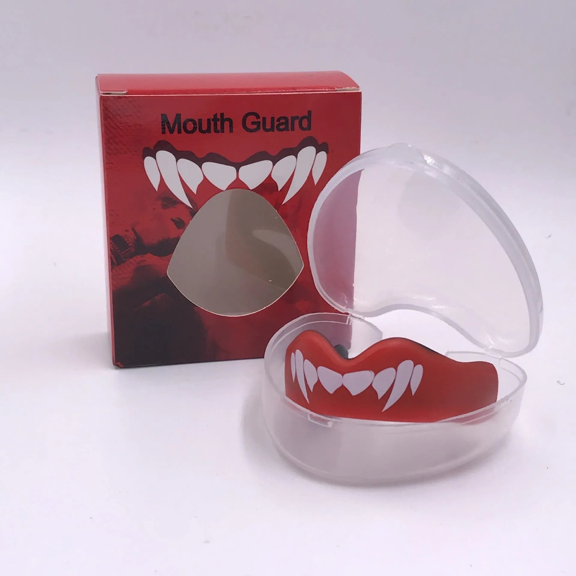 Adult boxing sports mouthguard with printed teeth design in black and white colour.