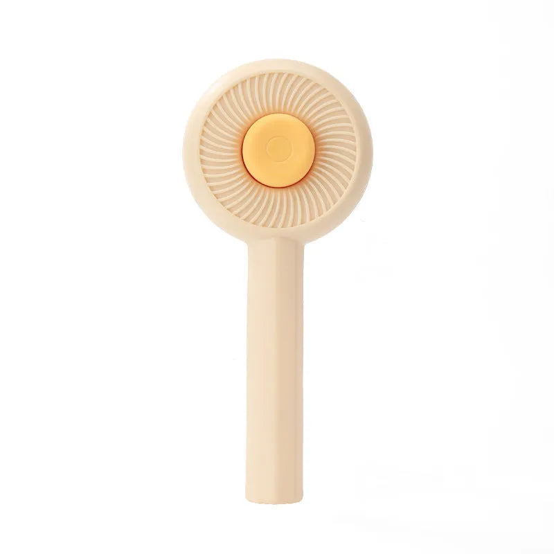 Blue and yellow pet grooming brush with angled metal bristles and a self-cleaning button.