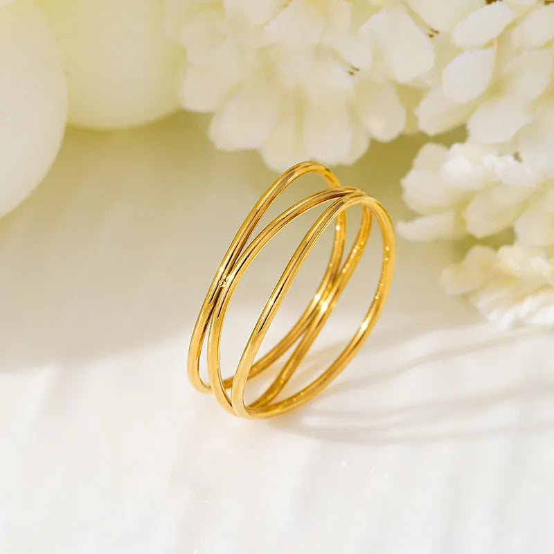 Gold titanium steel ring with three-layer coil geometric design