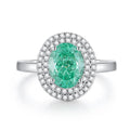 Geometric S925 silver ring with an oval Palaibahao stone and diamond inlay on a model's finger.