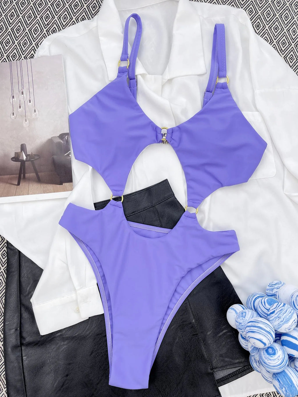 Purple one-piece swimsuit made from nylon with 80% fabric content, available in S, M, L sizes