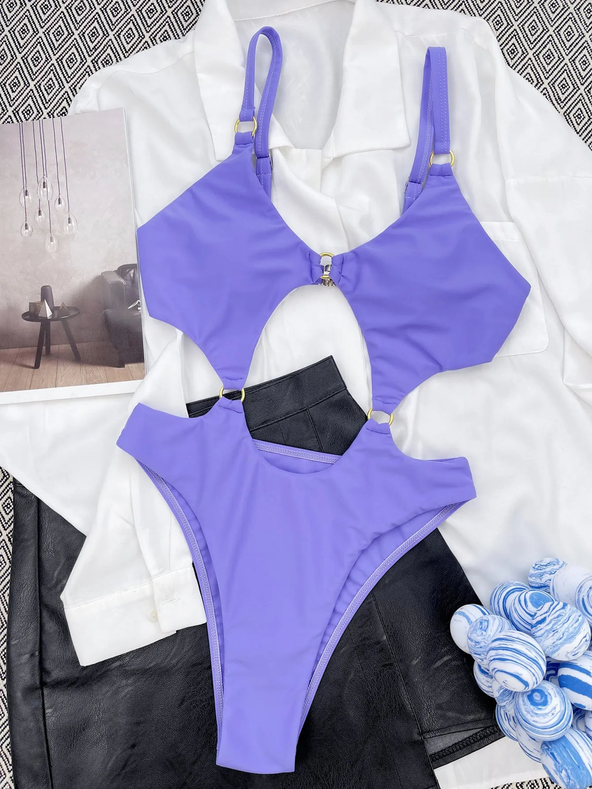 Purple one-piece swimsuit made from nylon with 80% fabric content, available in S, M, L sizes