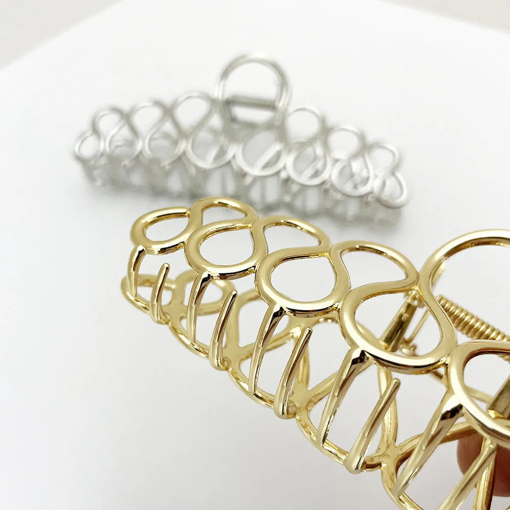 Minimalist large hair clip in gold electroplated alloy with tassel detail for thick hair