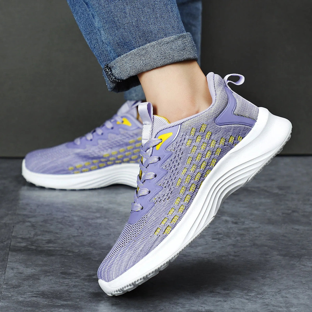 Women's lavender purple Flyknit running shoes with mesh lining and EVA sole, shown in a side view.