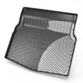 Black TPE car boot liner with carbon fibre pattern texture, shown fitted in a vehicle trunk.