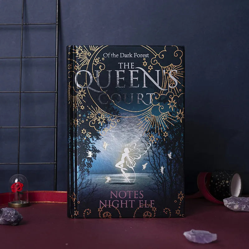 Blue and purple A5 hardcover luminous notebooks open to show full-colour illustrated pages.