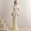 Women's slim fit backless dress with high collar, long sleeves and pleated detail in polyester fabric