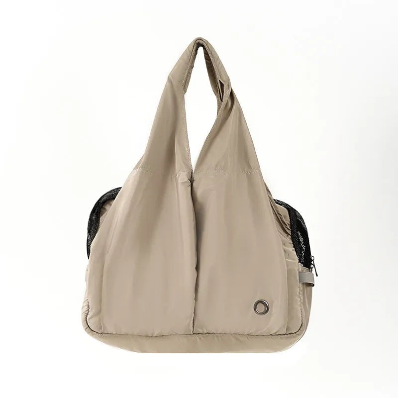 Apricot coloured cloth pet carrier handbag for small dogs and cats, shown with dimensions 41cm by 16cm by 28cm.