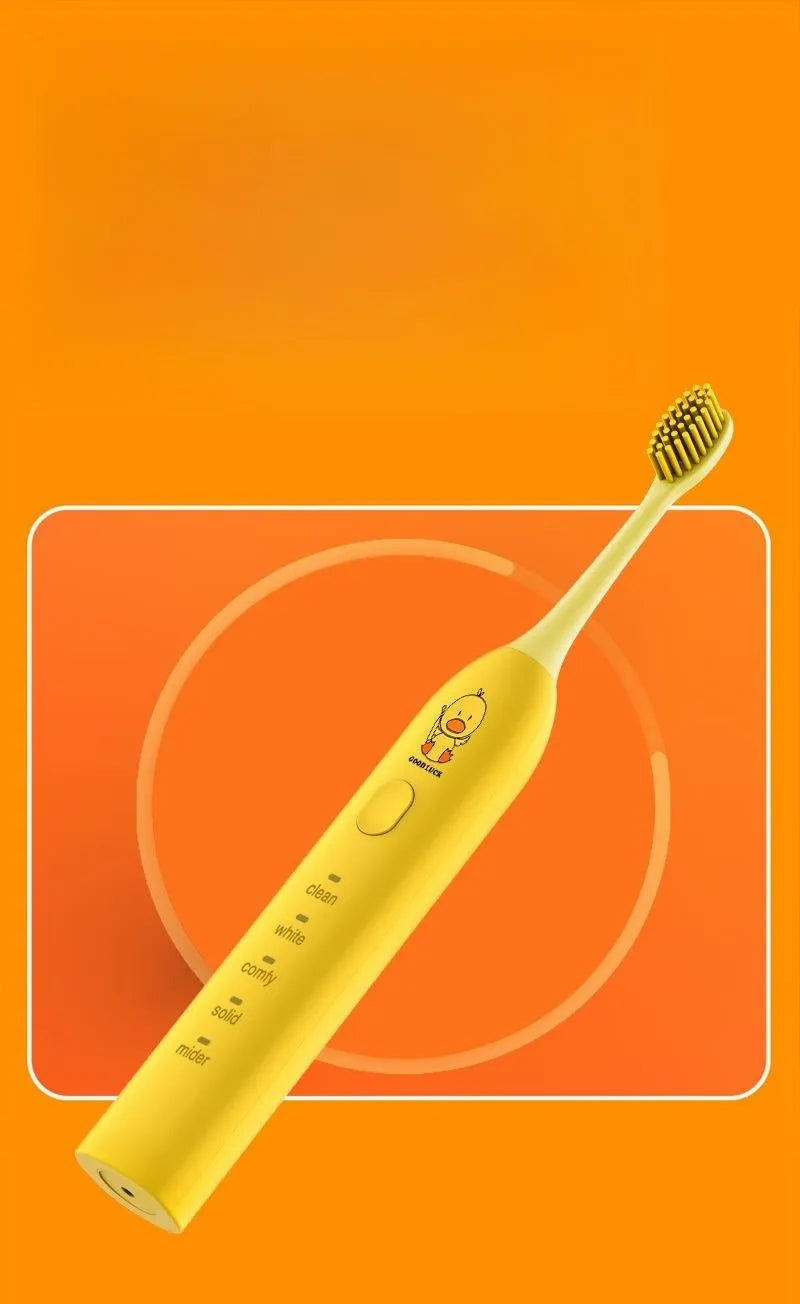 Rechargeable electric toothbrush in yellow with small duck design showing soft bristle brush head