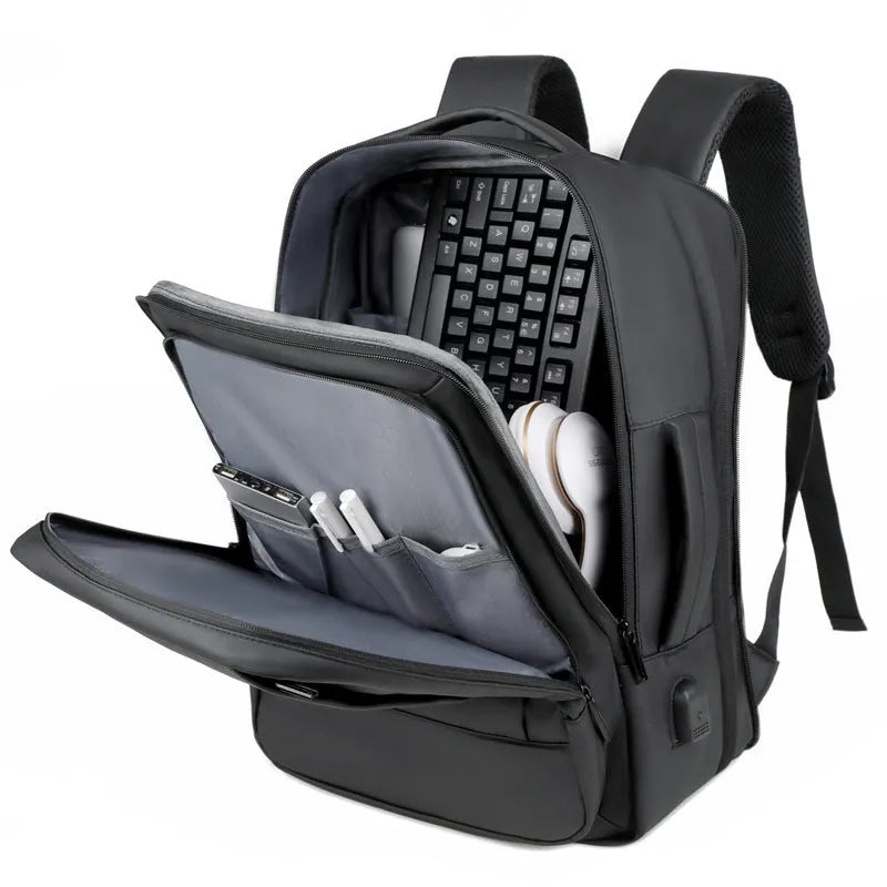 Black waterproof Oxford cloth backpack with curved shoulder strap showing 20-35 litre capacity