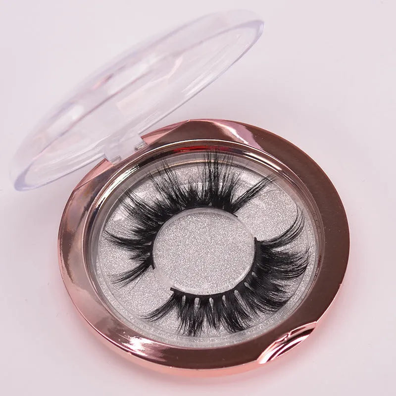 5D mink false eyelashes with protective hair cap and double-headed brush on white background