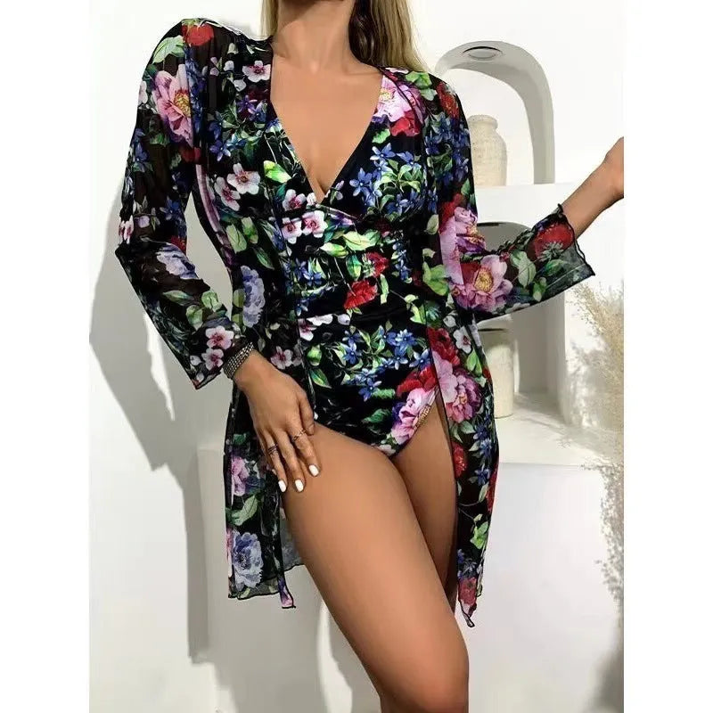 Women's floral print bikini three-piece swimsuit set in green, shown with a matching coat.