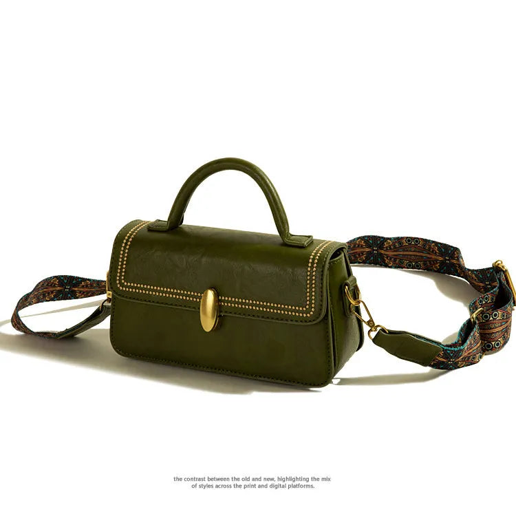 Brown retro messenger bag with square vertical shape showing contrast stitching and shoulder strap