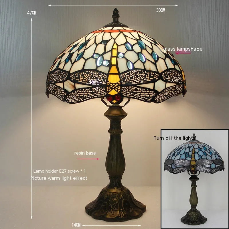 Stone table lamp with Tiffany-style blue dragonfly design on base