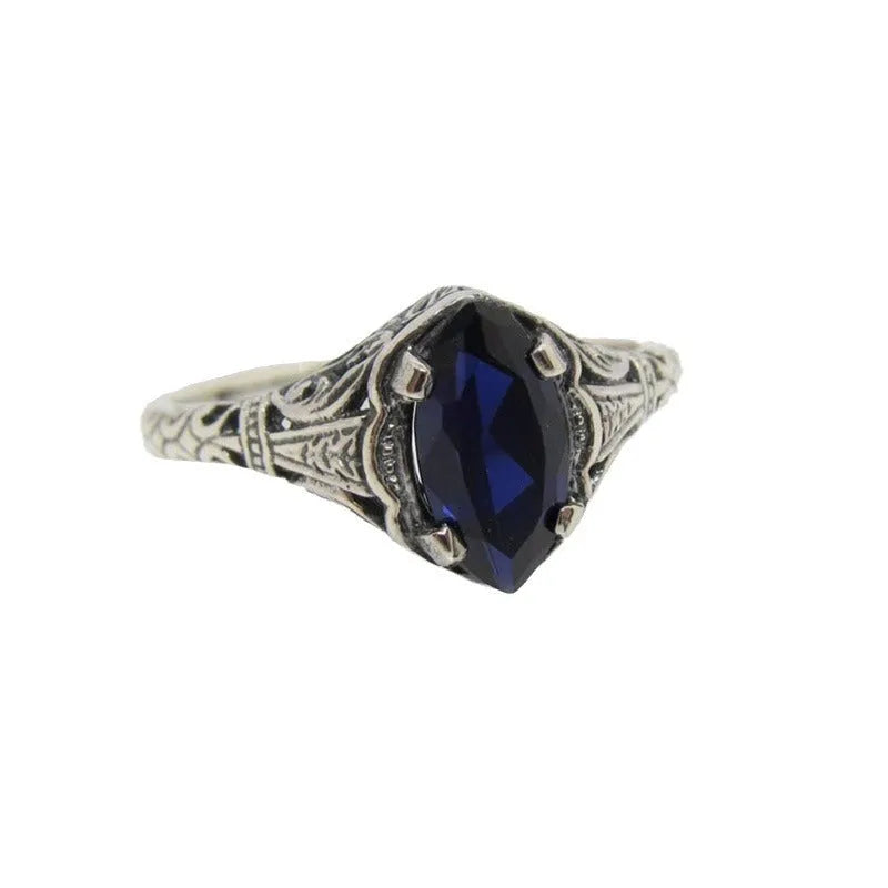 Silver women's ring with geometric hollow pattern, shown in size US7.