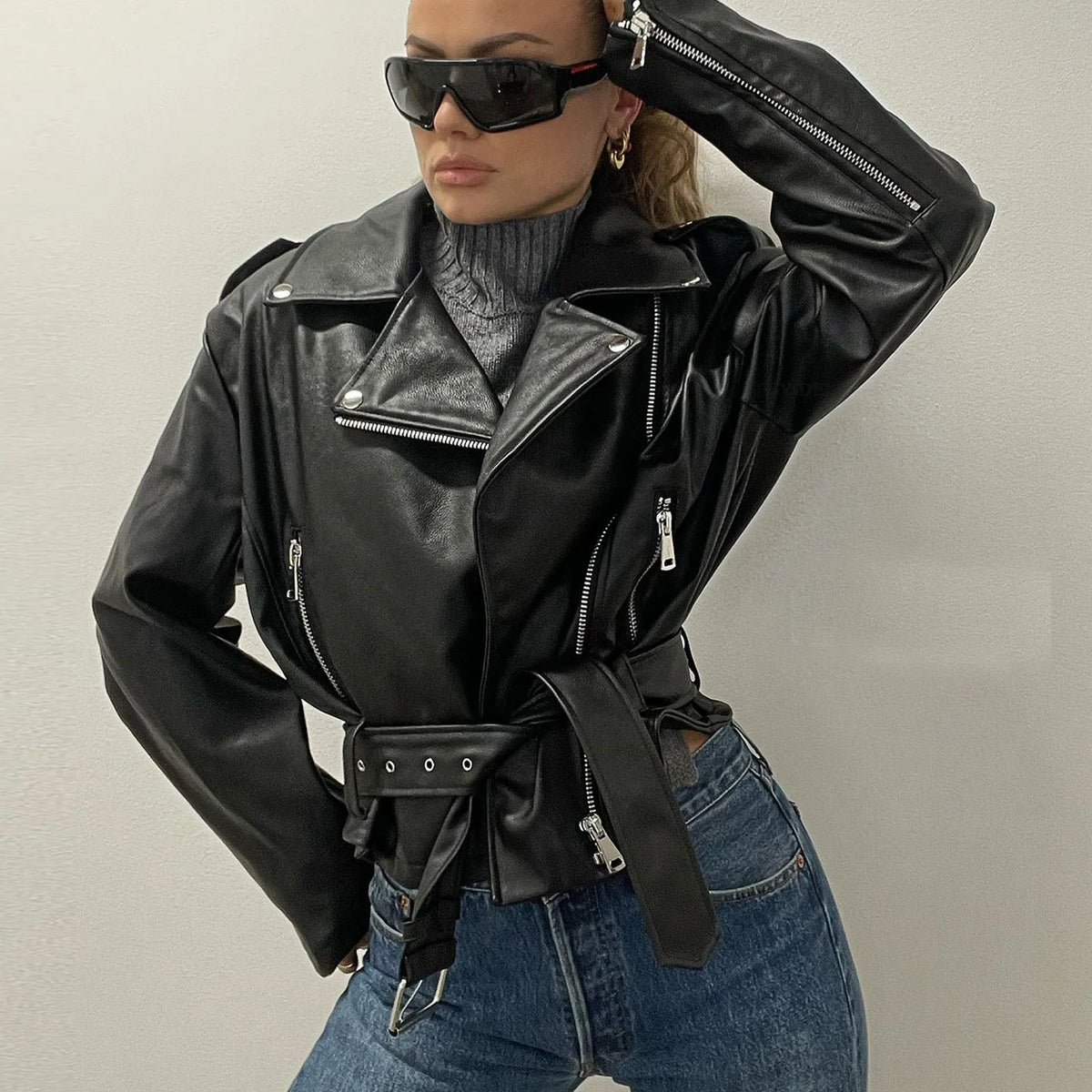 Black punk locomotive style jacket with a Peter Pan collar and an adjustable belt.