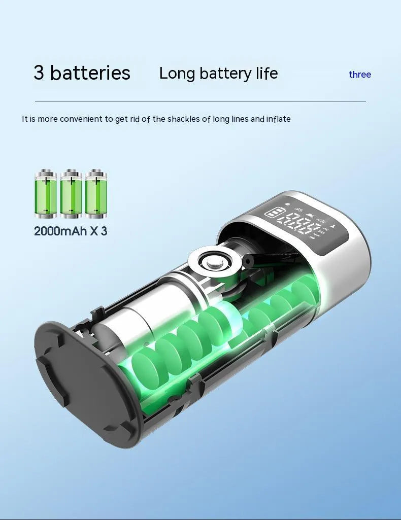 Black portable wireless air pump with digital display, LED light, and attached inflation tube on a textured surface.
