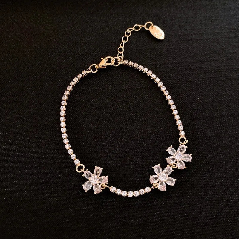 Gold-tone copper bracelet with geometric shapes and zircon stone detailing for women's fashion