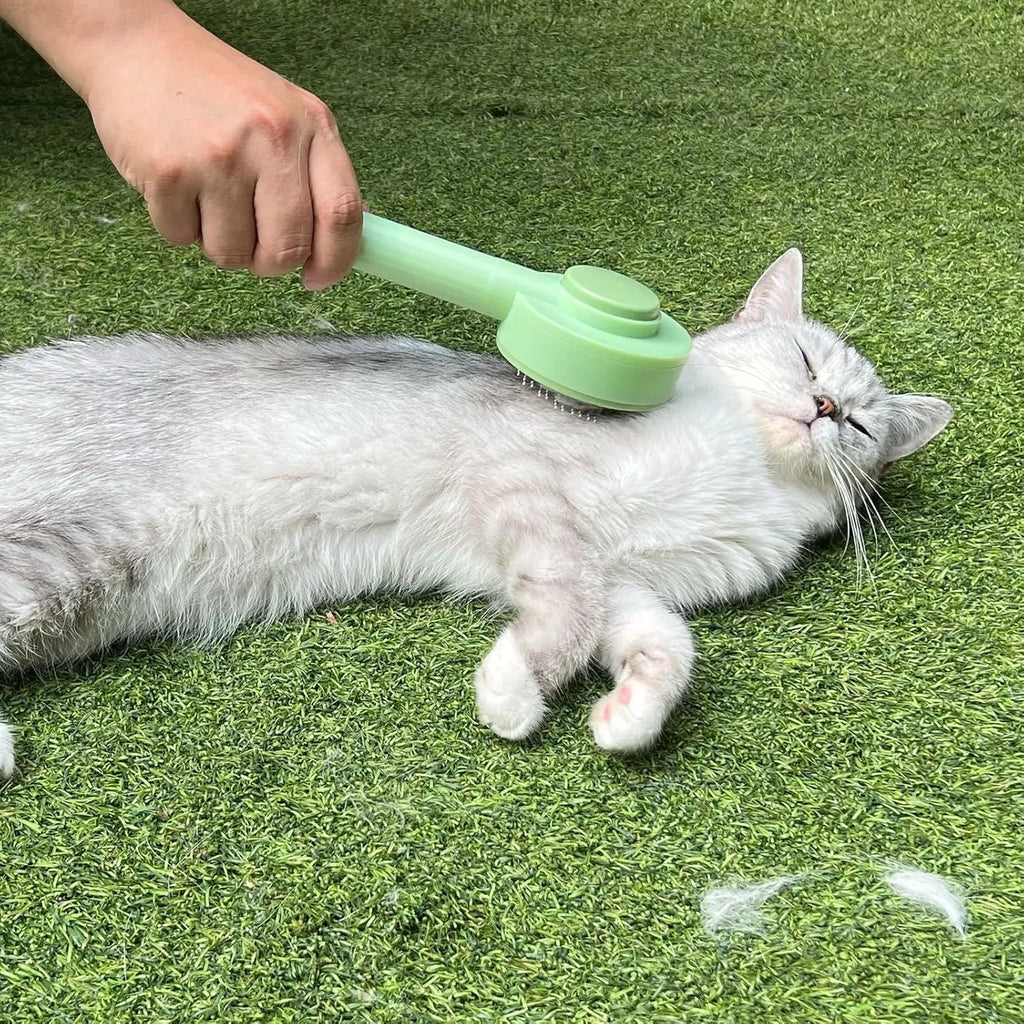 Green and yellow pet grooming brush with stainless steel deshedding teeth and hanging loop