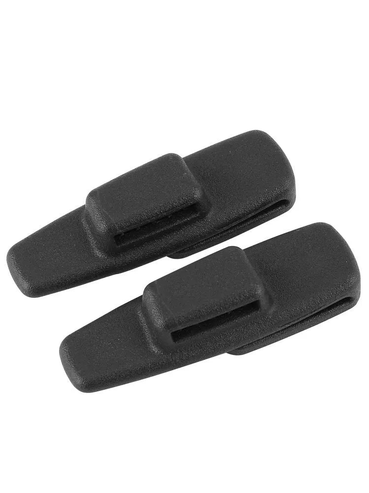 Black ABS plastic car seatbelt stopper clip preventing belt retraction