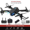 S138 black folding drone with propellers extended, shown next to its storage bag, highlighting its compact design and camera module.