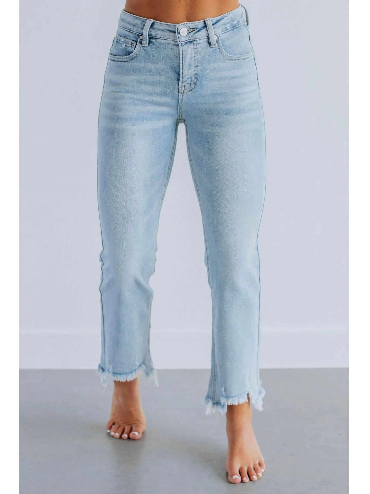 Women's dark blue casual denim jeans with hand-worn distressing on a solid cotton fabric