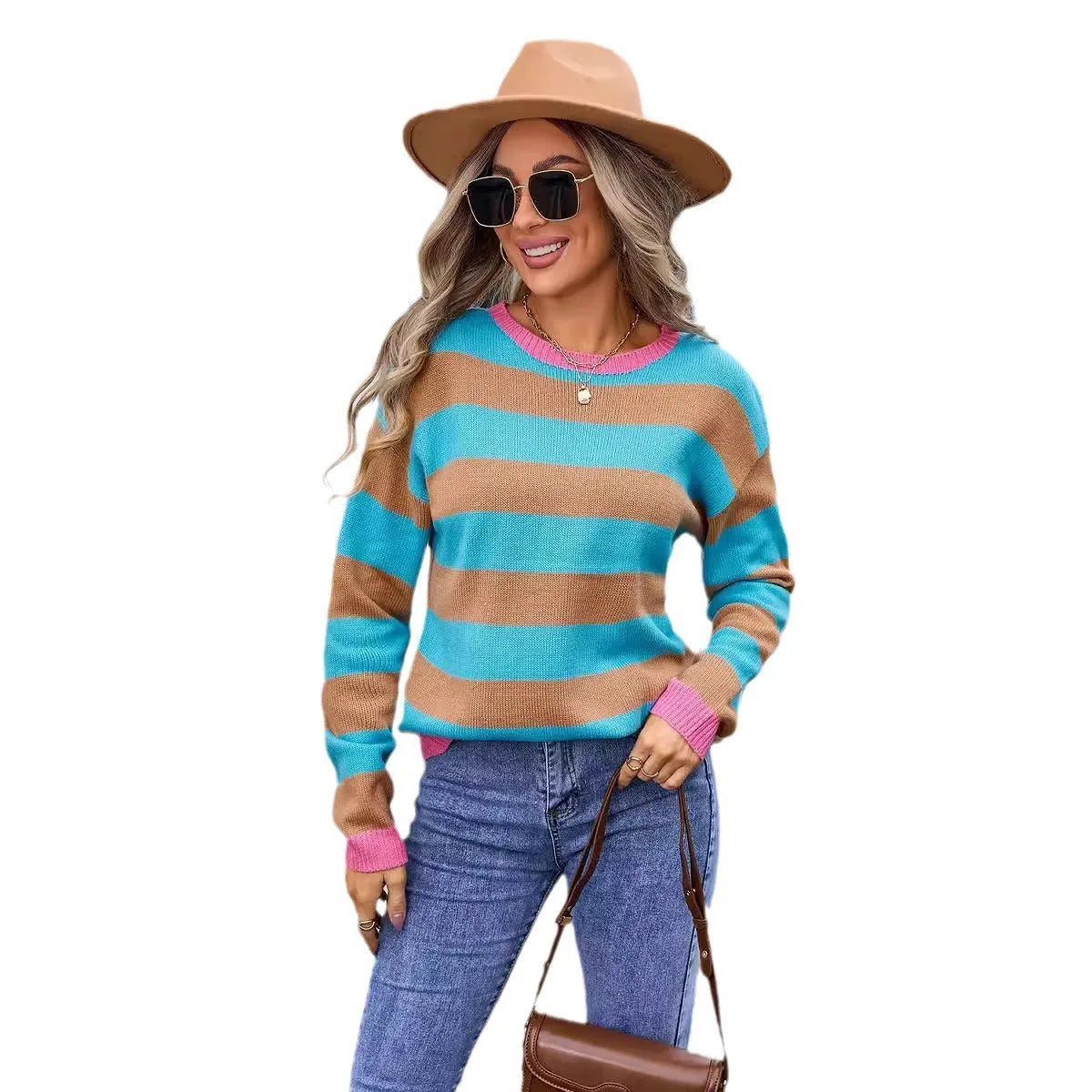 Women's loose fit long sleeve acrylic sweater in blue, showing round neck and stripe detail.