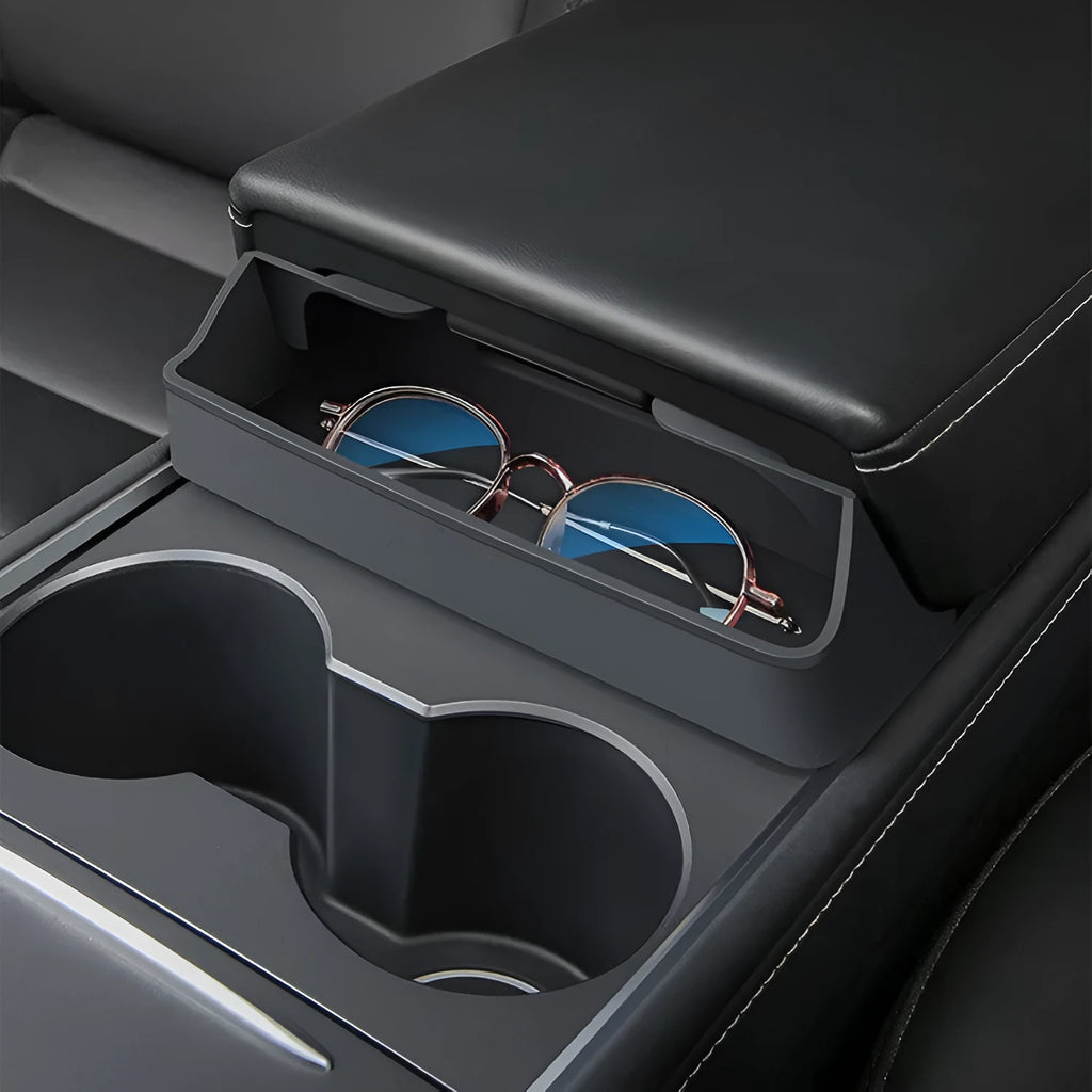 Black silicone glasses storage case mounted inside a Tesla Model 3/Y centre armrest console.