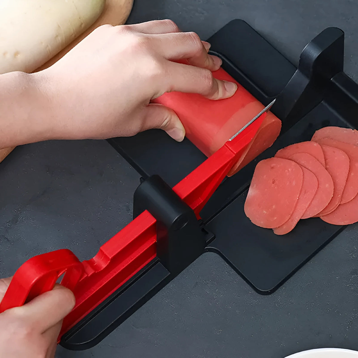 Green and red vegetable cutter with stainless steel blade for slicing carrots and potatoes