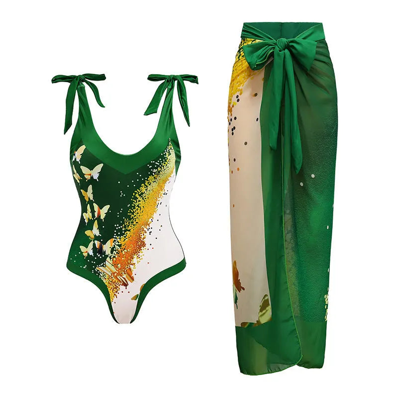Women's solid colour one-piece swimsuit with thin spaghetti straps and a matching removable skirt.