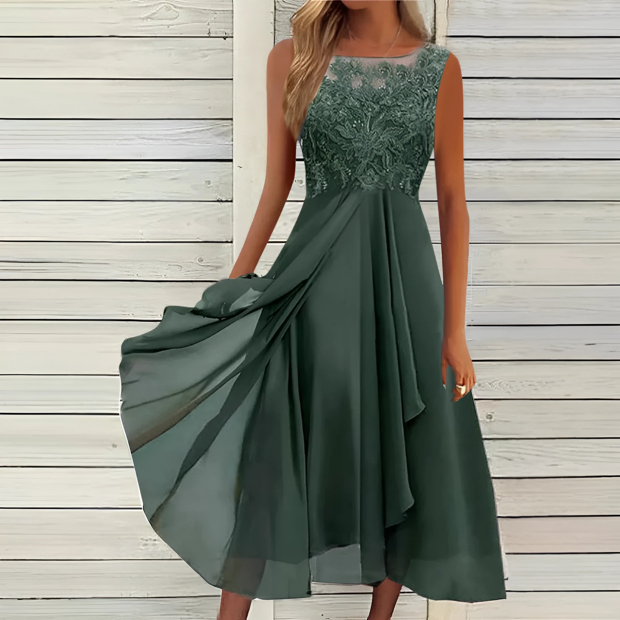 Women's sleeveless chiffon dress with lace hollow-out detail in princess style, shown in green colour