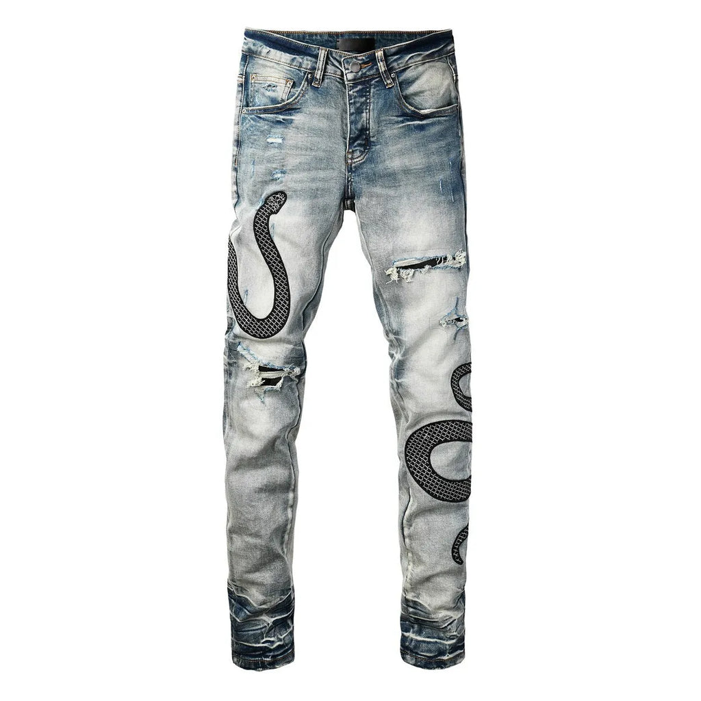 Men's blue distressed skinny jeans with wash finish showing button fly and slim fit
