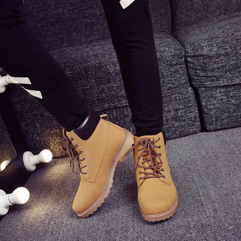 Men's pink high-top Martin boots with velvet lining and flat sole on a white background.