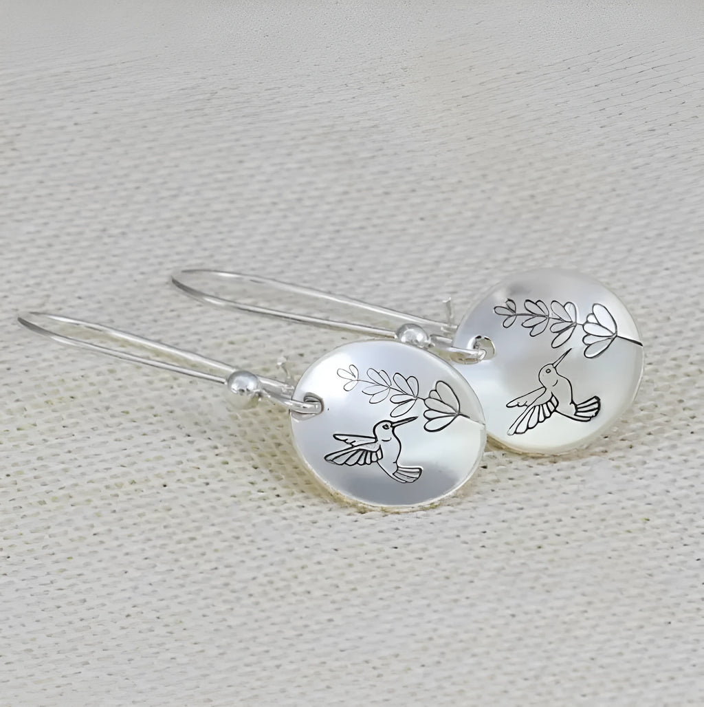 Silver zinc alloy earrings with bird, flower, leaf and zodiac designs in glossy round finish