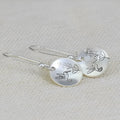 Silver zinc alloy earrings with bird, flower, leaf and zodiac designs in glossy round finish