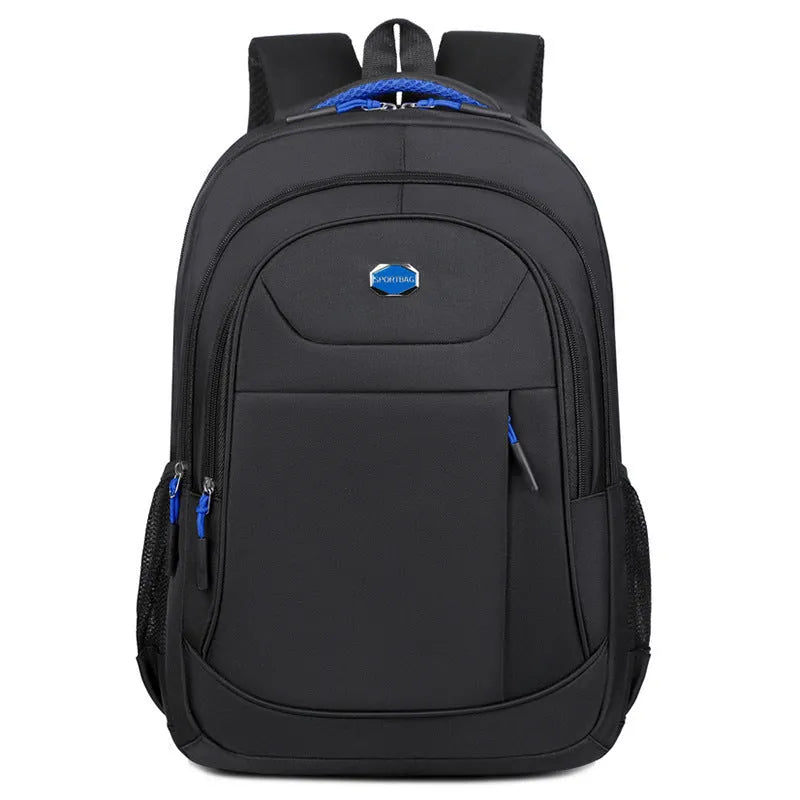 Solid colour Oxford cloth backpack with curved shoulder straps, shown in black, blue, green, or red.