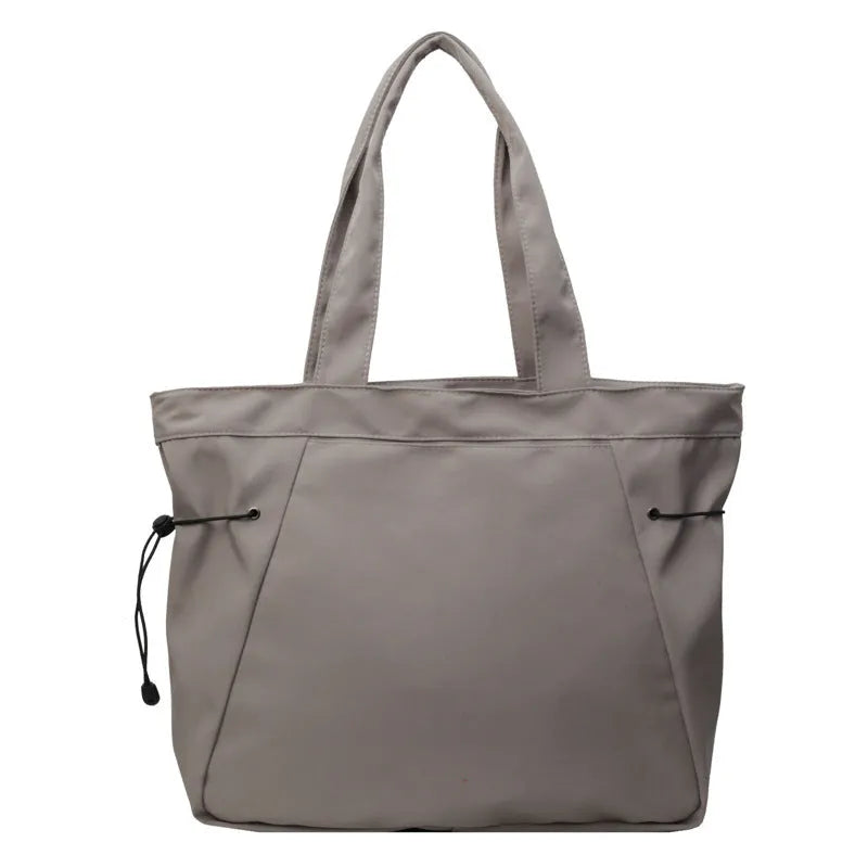 Soft Oxford cloth foldable tote bag in street style, shown in available colours.