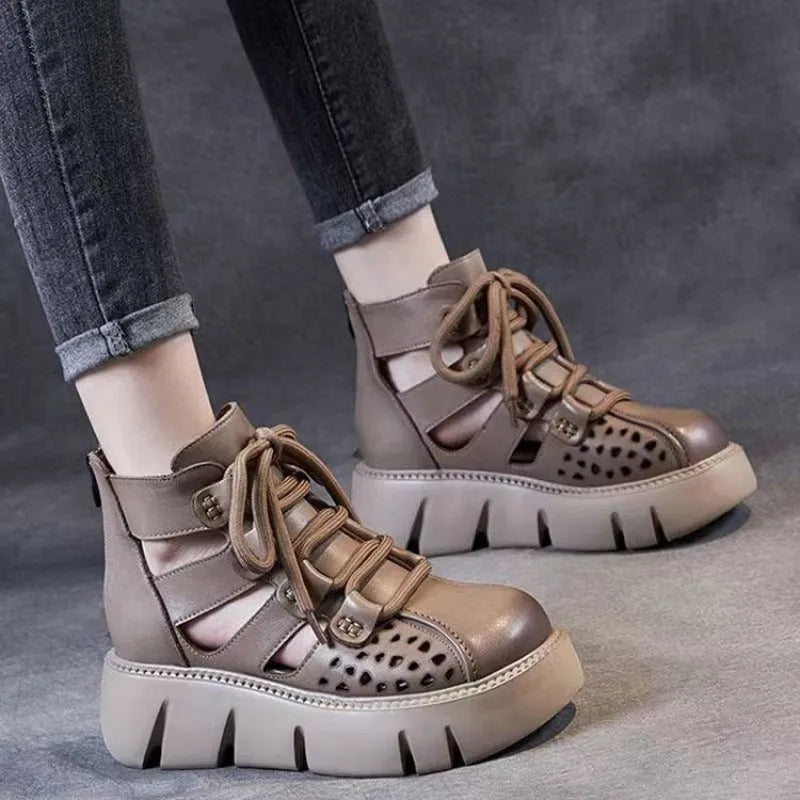 Women's black platform sandals with hollow hole design and fish mouth toe, made from soft leather.