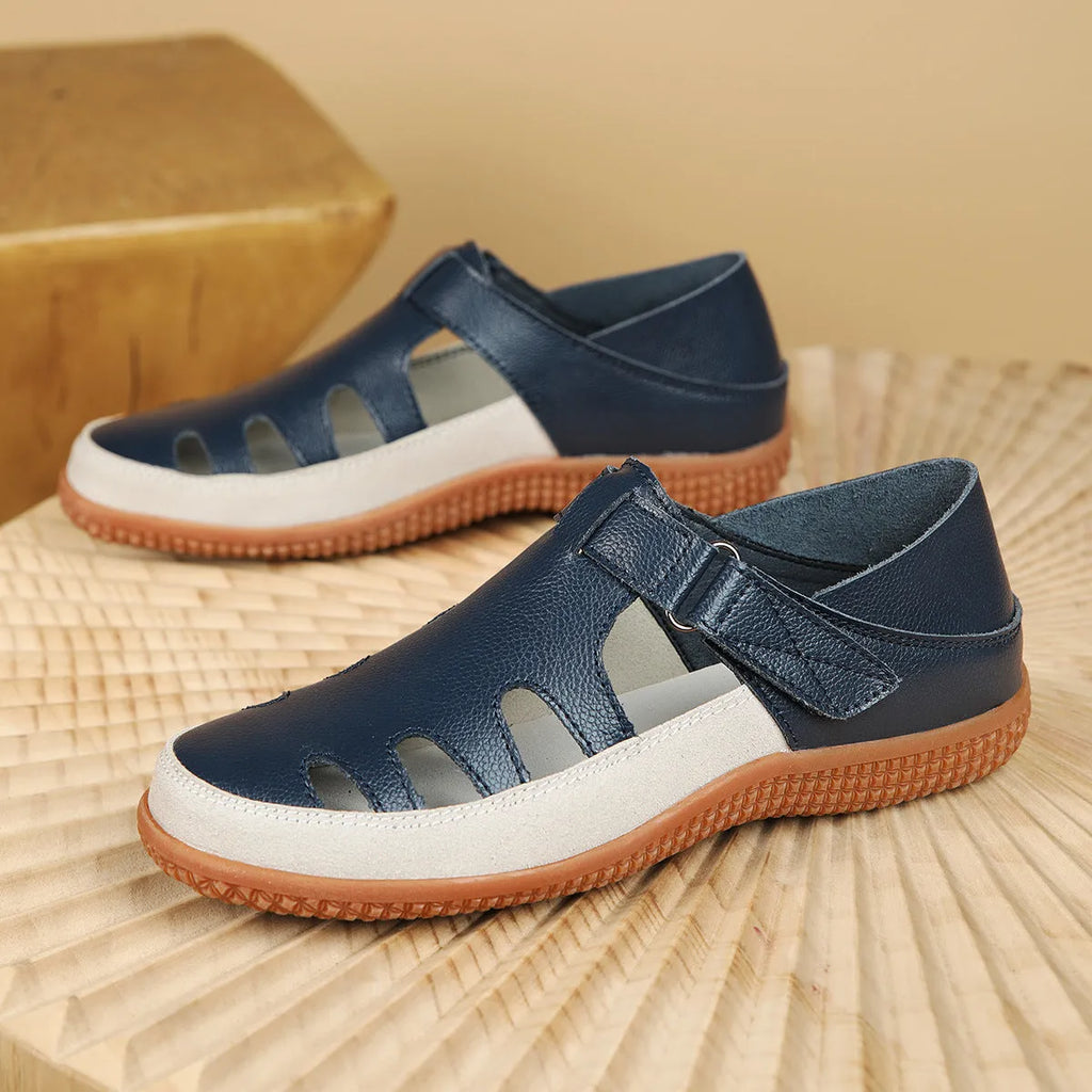 Women's plus size flat heel sandals with hollow toe cap design in blue colour showing thick rubber sole
